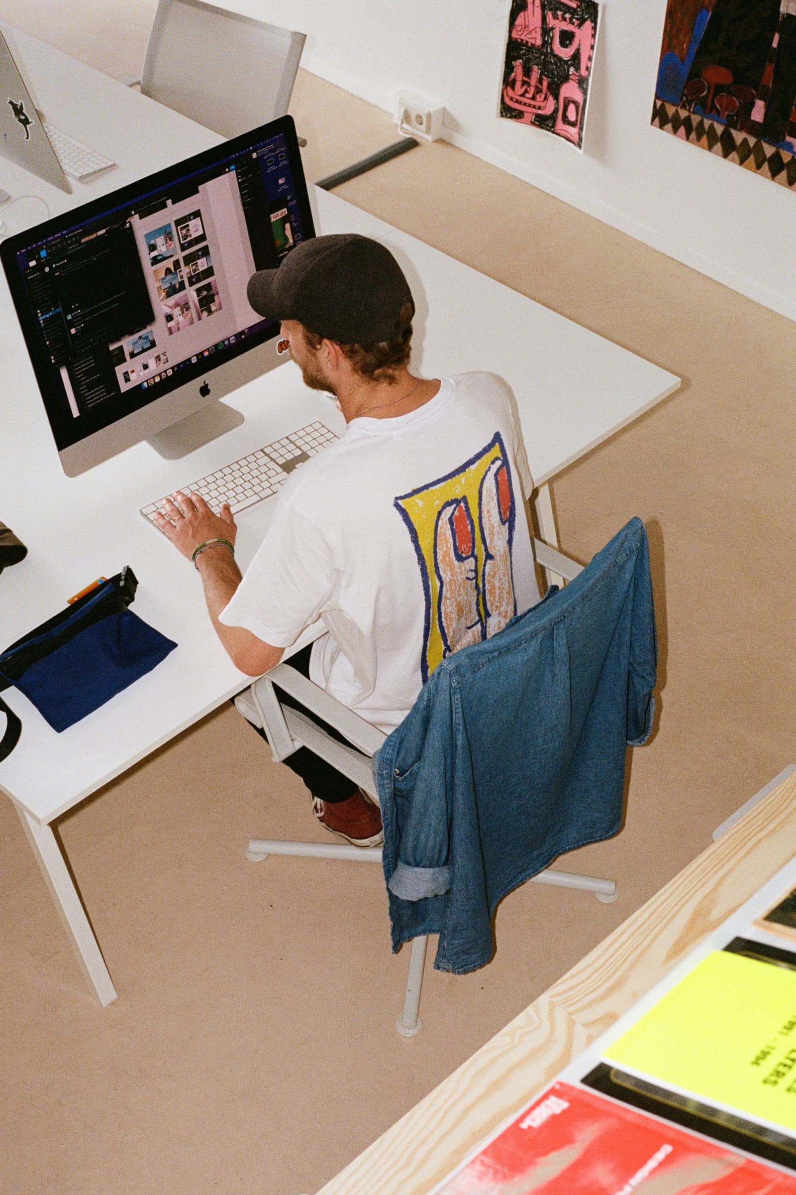 Image of Hugues, office manager, working behind his computer at the Antinomy Studio office in Amsterdam